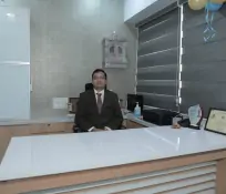 Dr. Pratik Shah in his cabin best pain management clinic in Ahmedabad
